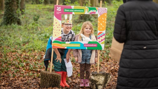 Children look through a selfie framed as part of an Easter trail
